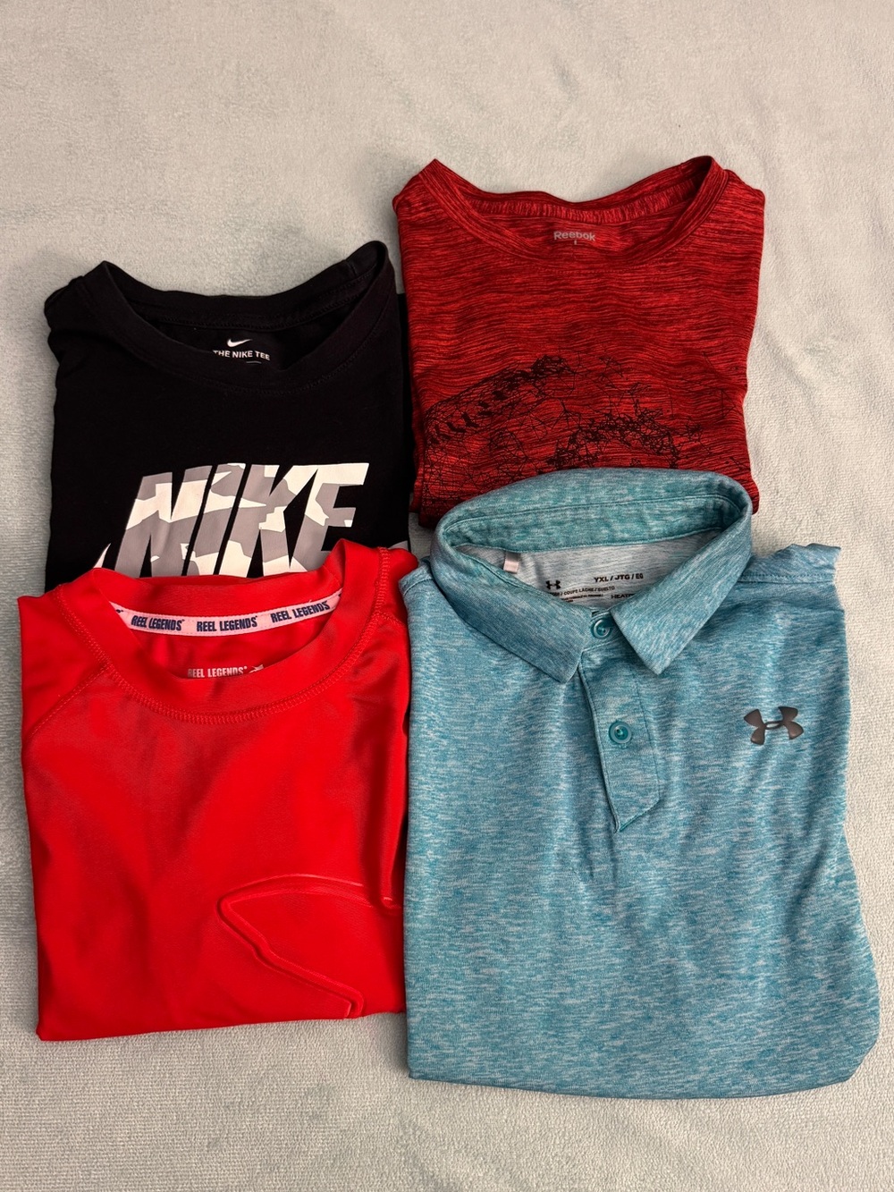 Bundle of 4 boys' shirts, sizes Youth L and Y  XLUNDER ARMOUR REEL NIKE Reebok